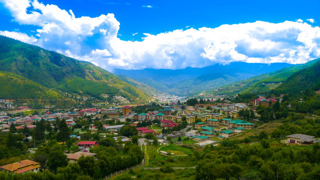 A large view of the capital of the Kingdom of Bhutan, called 'Thimphu' from a hill by day