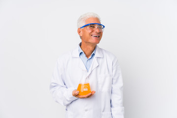 Mature chemical man isolated dreaming of achieving goals and purposes