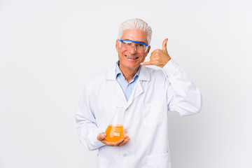 Mature chemical man isolated showing a mobile phone call gesture with fingers.