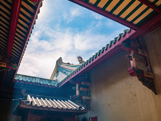 Fototapeta na wymiar Chinese Temple Rooftop with blue sky