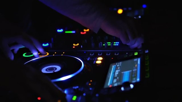 Two DJs are Mixing in Twilight