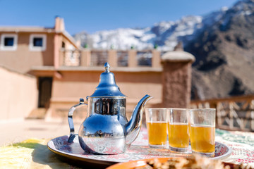 Famous Moroccan mint tea and silver kettle in High Atlas mountains