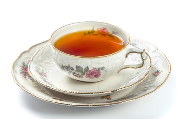 Cup of tea on a white background, closeup side view
