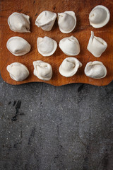 tortellini with filling (ravioli dumplings) menu concept. food background. top view. copy space