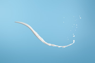 fresh white milk splash isolated on blue