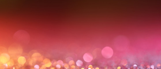 Red blurred abstract shiny valentines day background with bokeh effect, festive pink glitter...