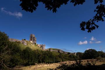 Fototapeta na wymiar Corfe Castle sitting atop a hill