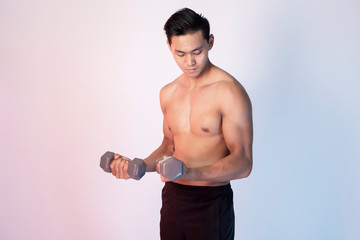 Handsome Muscular fitness man in studio