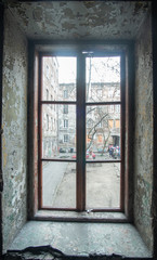 Fototapeta na wymiar Old big window in abandoned 19th century house.