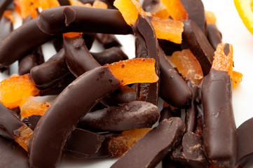 Seasonal candies and sweets,citrus fruit dipped in chocolate and homemade sweet treat concept with...