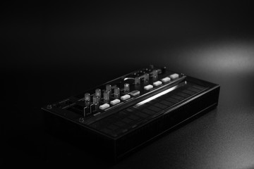 small analog fm modulation synthesizer, with knobs and faders, with effects, arpeggiator and...