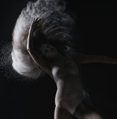 Strange dance with dust performed by graceful girl © Wisky