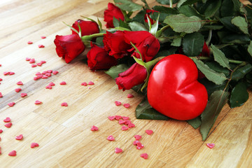 Flowers composition. Frame made of rose flowers, confetti. Valentine's Day background.