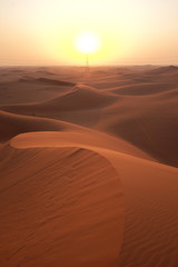 Desert sunrise with power transmission towers and lines for solar energy concept. Riyadh, Saudi Arabiar 