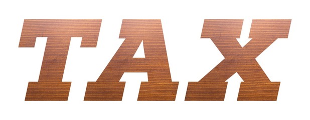 TAX word with brown wooden texture on white background.