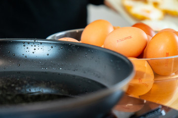 A lot of eggs and a black pan