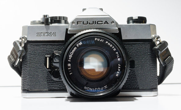 london, england, 05/05/2018 A Retro vintage fujica stx 1 single lens reflex film camera with leather case, and 50mm 1.9 x fujinon lens. vintage hipster camera making a fashionable come back