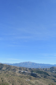 Benaque and mountains a sunny day