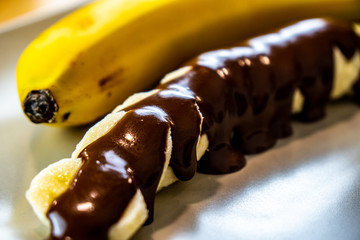 A lot of slices of banana with chocolate