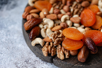 Natural healthy and delicious vegan dessert. Concept of sweet, low calories and tasty snack. Wooden dark rustic board, neutral background. Close up, macro 
