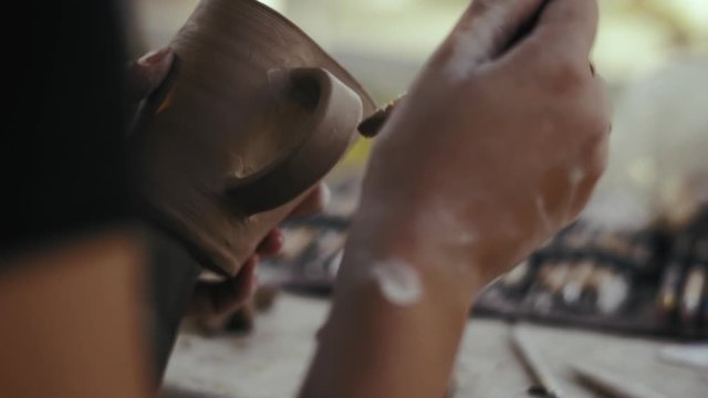 Close-up, Woman Potter Handles A Raw Clay Mug