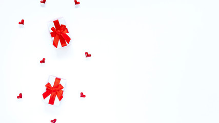 Valentines Day banner with hearts and white and red gift boxes isolated on white backdrop. Copy space. Romantic festive template concept for greeting card, advertising. Women’s day. Place for text.