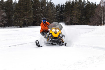 Athlete on a snowmobile.