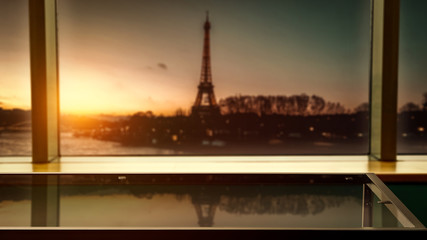 Glass table of free space for your decoration.Big window background and landscape of Paris city. 