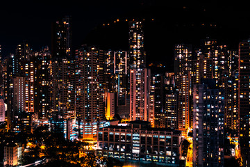 Fototapeta na wymiar city lights of skyscraper buildings at night, downtown cityscape of hongkong at night