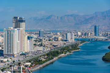 Plakat Aerial view of Ras al Khaimah, United Arab Emirates north of Dubai, looking at the city, , Jebal Jais - and along the Corniche.
