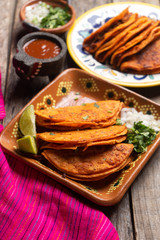 Mexican beef barbacoa tacos on wooden background