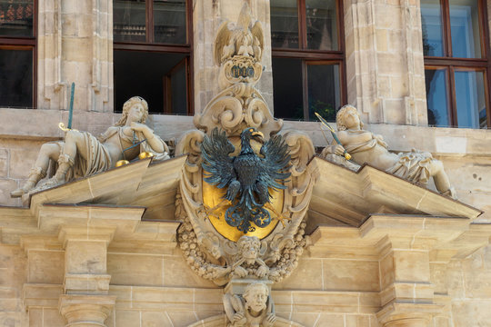 Coat of arms with eagle and sculptures over entrance of the old town hall  in Nuremberg, Bavaria, Germany