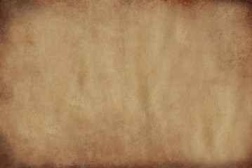 Parchment paper aged by time with burnt edges of yellow color.Texture or background