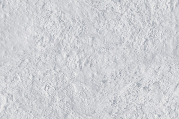 White snow close-up with a textured rough surface .Texture or background