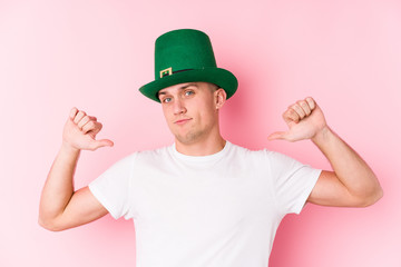 Young caucasian man celebrating saint patricks day feels proud and self confident, example to follow.
