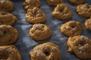 Swedish yellow saffron buns with pearl sugar before baking