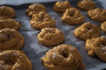 Swedish yellow saffron buns with pearl sugar before baking