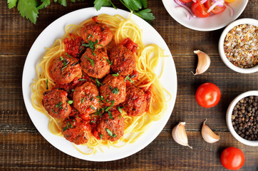 Fried meatballs and spaghetti on plate