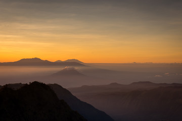 A beautiful scene of Mount Bromo at sunrise or sunset taken from best view point, Penanjakan. Mount Bromo is an active volcano and one of the most visited tourist attractions in East Java, Indonesia.