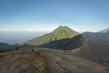 Stunning path with beautiful view on Ijen Crater. Ijen Crater is a volcanic tourism attraction in Indonesia, located on East Java, famously contains the world’s largest acidic volcanic crater lake.