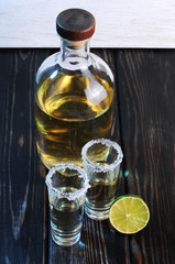 Bottle of whiskey on a wooden background.Studio photography	