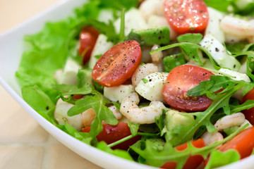 Bright vegetable salad with shrimp and cheese.