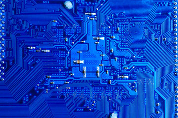 blue circuit board background of computer motherboard,Electronic computer hardware technology.Integrated communication processor. Information engineering component. Blue color.