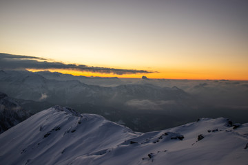 Naklejka na ściany i meble A beautiful view of a sunrise and himalayan mountains from the summit of a himalayan mountain