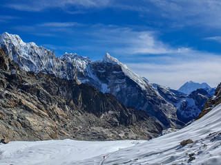 At the top of Cho La pass. Picturesque snow-capped mountain view. Everest base camp trek: from Dragnag to Dzongla via Cho La pass. Trekking in Solokhumbu, Nepal.
