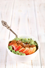 Breakfast with oatmeal and fruit.