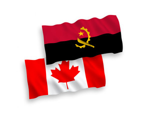 National vector fabric wave flags of Canada and Angola isolated on white background. 1 to 2 proportion.