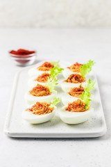 Smoked paprika deviled eggs. Selective focus, space for text.