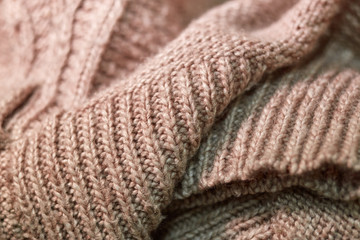 Rows of folded woolen product large knitted.