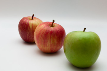 three isolated apples on a white background